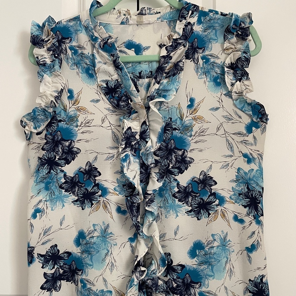 Milano beautiful blue floral hues Button-Up with ruffle up the closure blouse